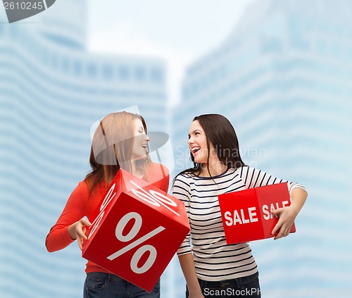 Image of smiling teenage girl with percent and sale sign