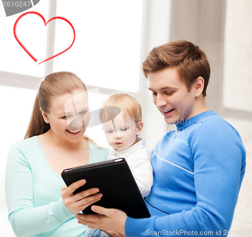 Image of parents and adorable baby with tablet pc