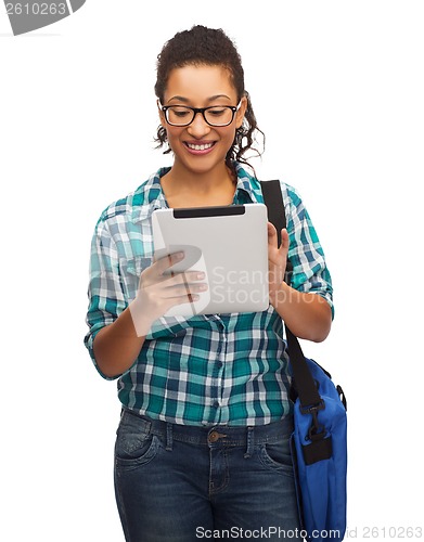 Image of student in eyeglasses with tablet pc and bag
