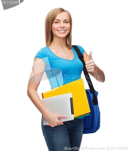 Image of female student with bag, tablet pc and folders