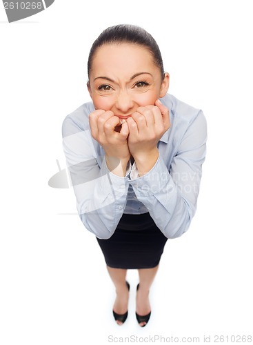 Image of frightened businesswoman biting her fingers