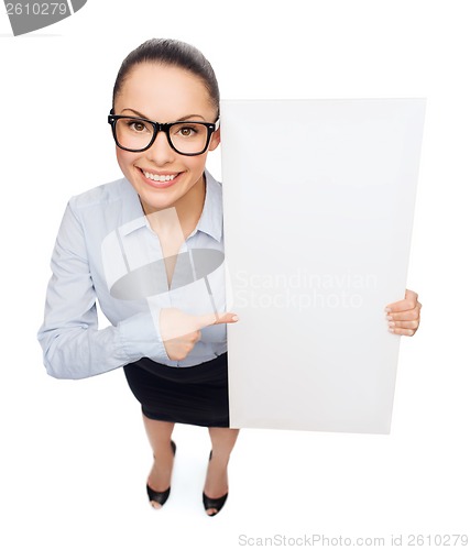 Image of smiling businesswoman with white blank board