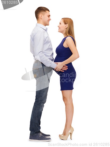 Image of happy young family expecting child