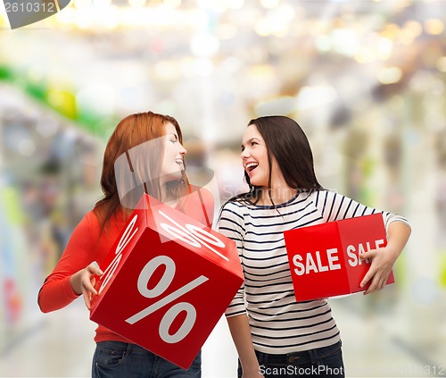 Image of smiling teenage girl with percent and sale sign