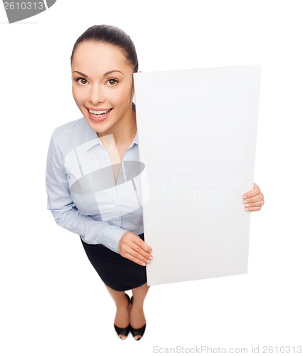 Image of smiling businesswoman with white blank board