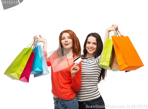 Image of teenage girls with shopping bags and credit card