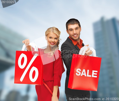 Image of smiling man and woman with shopping bag