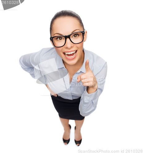 Image of smiling businesswoman with finger up