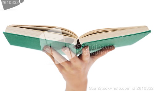 Image of close up of woman hand holding open book