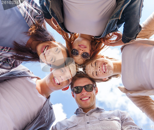 Image of group of teenagers looking down