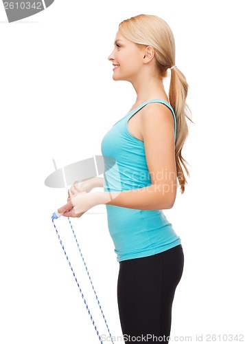 Image of sporty woman with with skipping rope