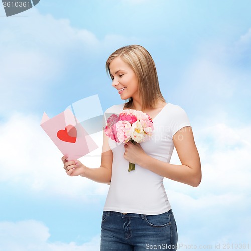 Image of smiling girl with postcard and bouquet of flowers