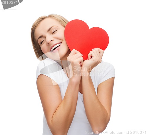 Image of smiling woman in white t-shirt with heart