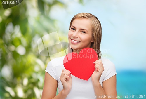 Image of smiling woman in white t-shirt with heart