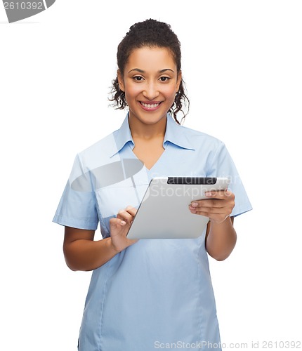 Image of smiling black doctor or nurse with tablet pc