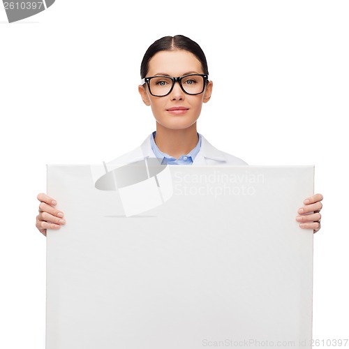 Image of female doctor in eyeglasses with white blank board