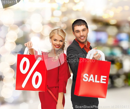 Image of smiling man and woman with shopping bag