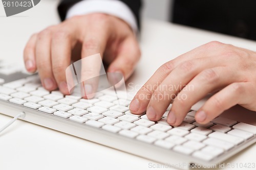 Image of businessman working with keyboard