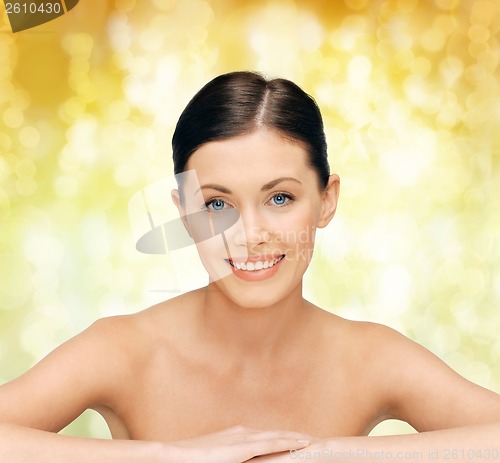 Image of face and hands of beautiful woman