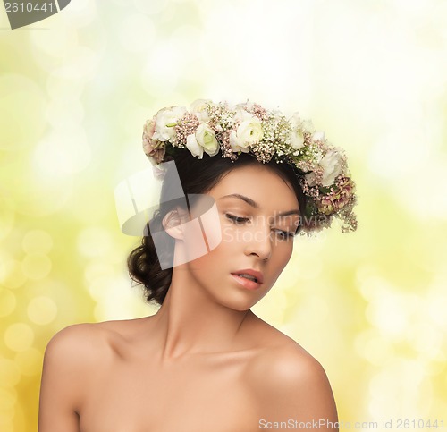 Image of beautiful woman wearing wreath of flowers