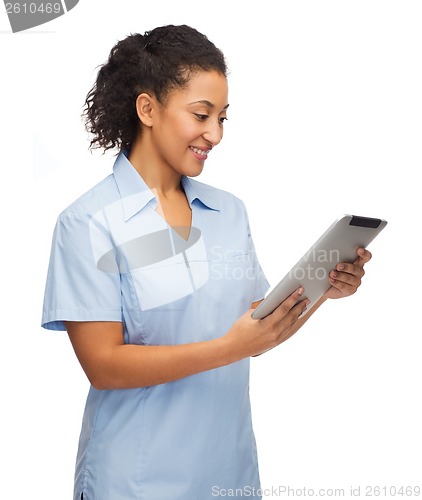 Image of smiling black doctor or nurse with tablet pc