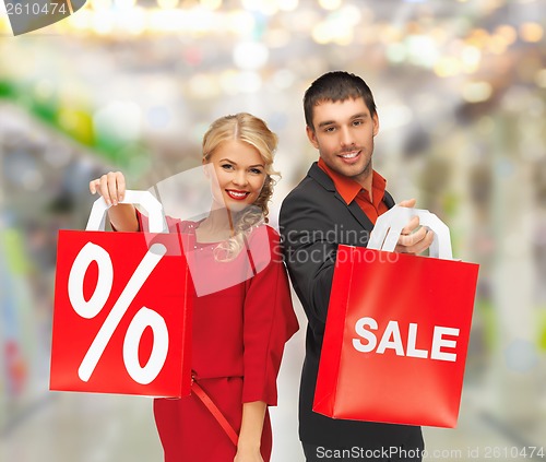 Image of smiling man and woman with shopping bag