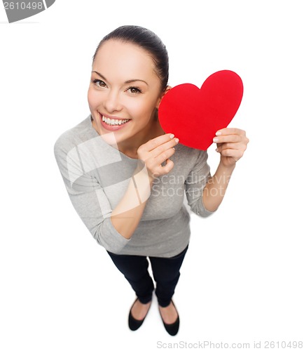 Image of smiling asian woman with red heart