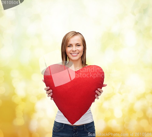 Image of smiling woman in white t-shirt with heart