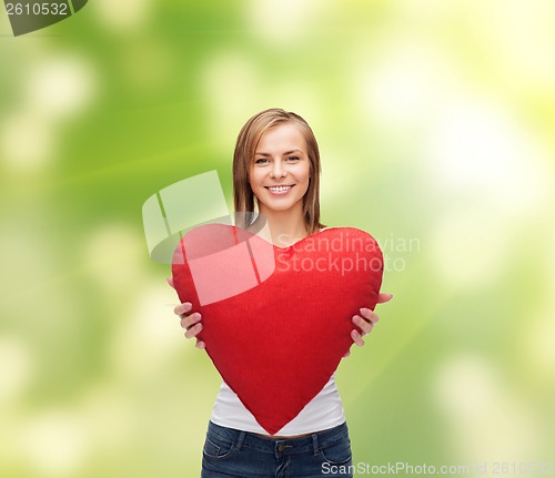 Image of smiling woman in white t-shirt with heart