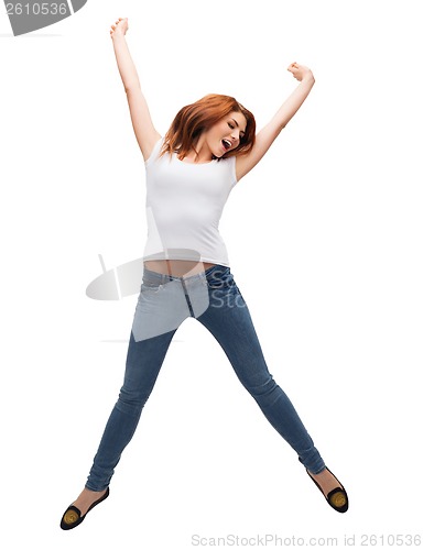 Image of teenage girl in white blank t-shirt jumping