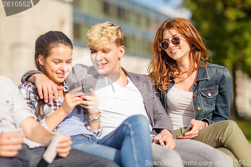 Image of group of students or teenagers with smartphones