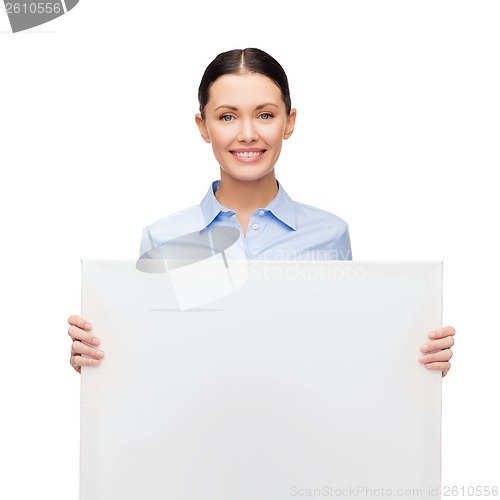 Image of smiling businesswoman with white blank board