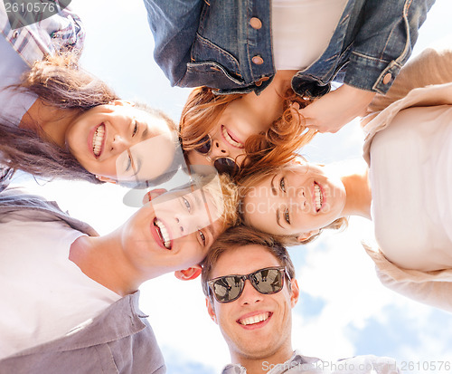 Image of group of teenagers looking down