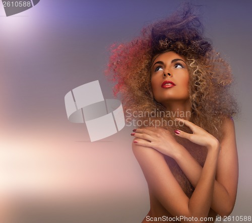 Image of woman with long curly hair