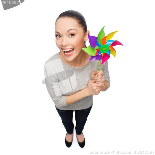 Image of smiling asian woman with windmill