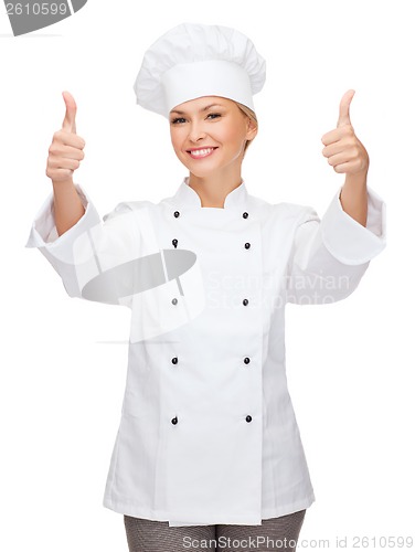 Image of smiling female chef showing thumbs up