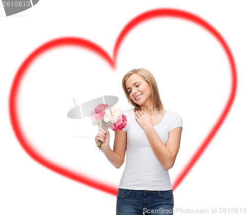 Image of smiling woman with bouquet of flowers