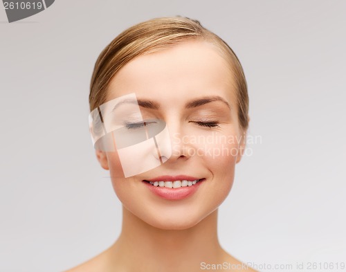 Image of face of beautiful woman with closed eyes