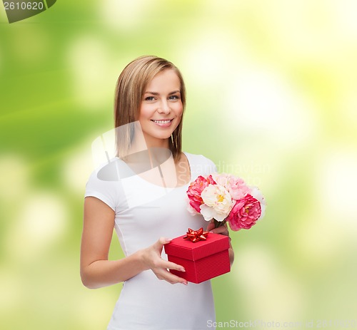 Image of smiling woman with bouquet of flowers and gift box