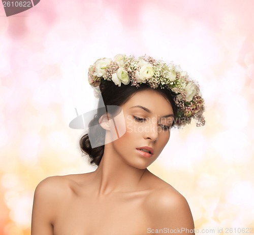 Image of beautiful woman wearing wreath of flowers