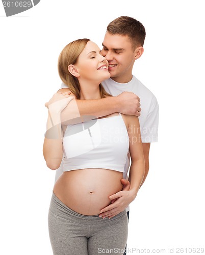 Image of happy young family expecting child