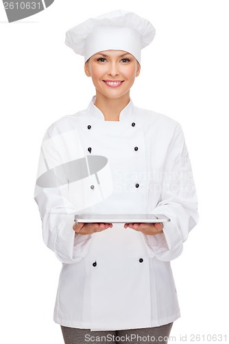 Image of smiling female chef with tablet pc computer