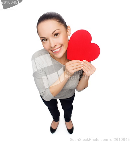 Image of smiling asian woman with red heart