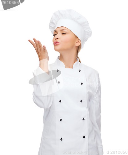 Image of smiling female chef showing delicious sign