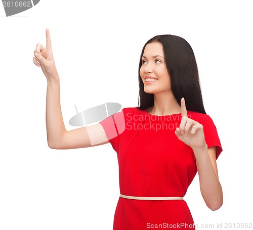 Image of woman in red dress working with virtual screen