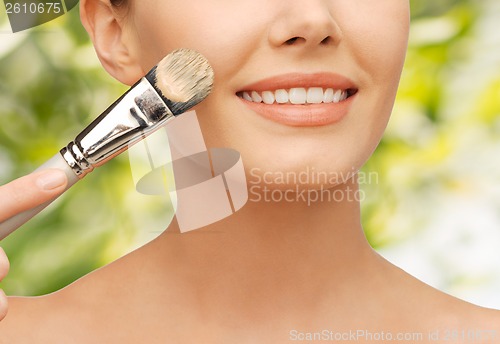 Image of beautiful woman with brush