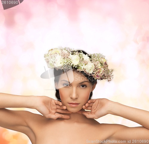 Image of beautiful woman wearing wreath of flowers