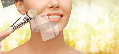 Image of beautiful woman with brush