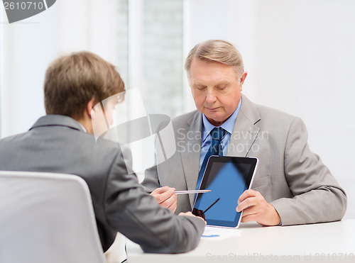 Image of older man and young man with tablet pc