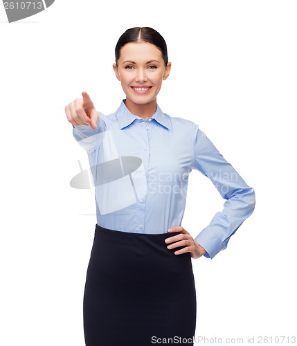 Image of smiling businesswoman pointing finger at you